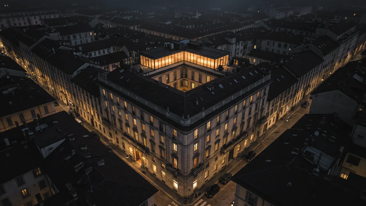 Ein Gebäude bei Nacht mit erleuchteten Fenstern